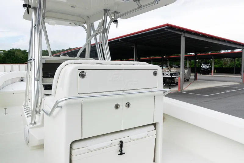 Slide: The Image of 2017 SeaVee 340Z boat interior with storage compartments, parked in a covered marina. - 30