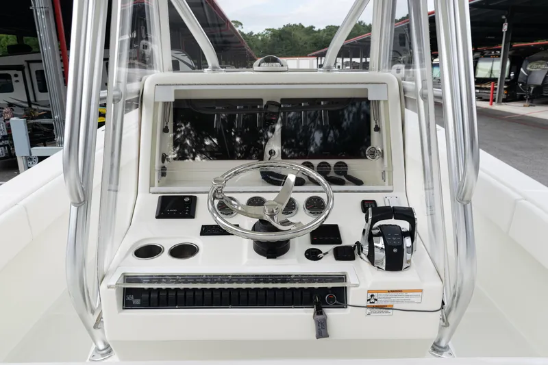 Slide: The Image of 2017 SeaVee 340Z boat console with steering wheel and controls. - 31