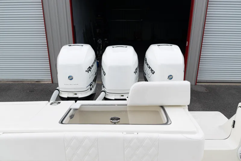 Slide: The Image of 2017 SeaVee 340Z boat with triple outboard engines in a storage facility. - 41