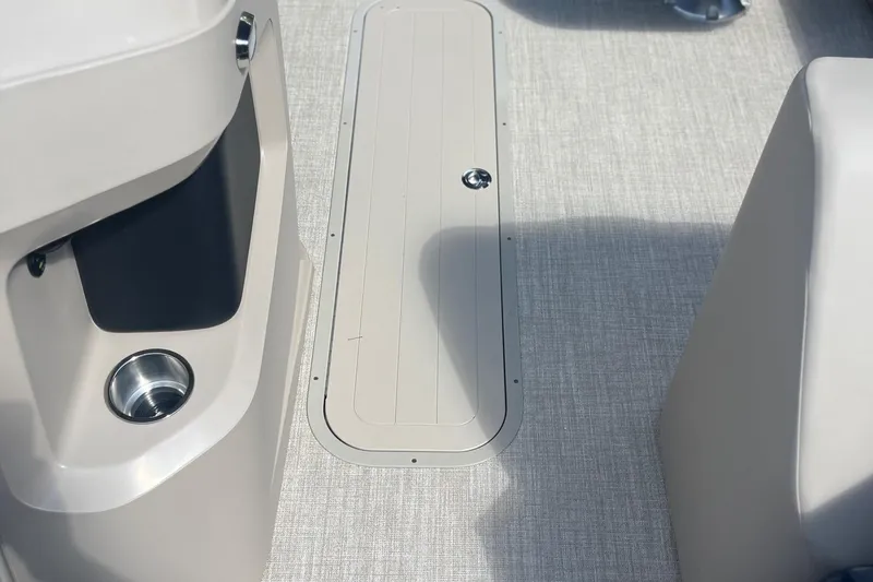 Slide: The Image of 2026 Avalon 23 LSZ Quad Lounger interior with sleek flooring and cup holder. - 3