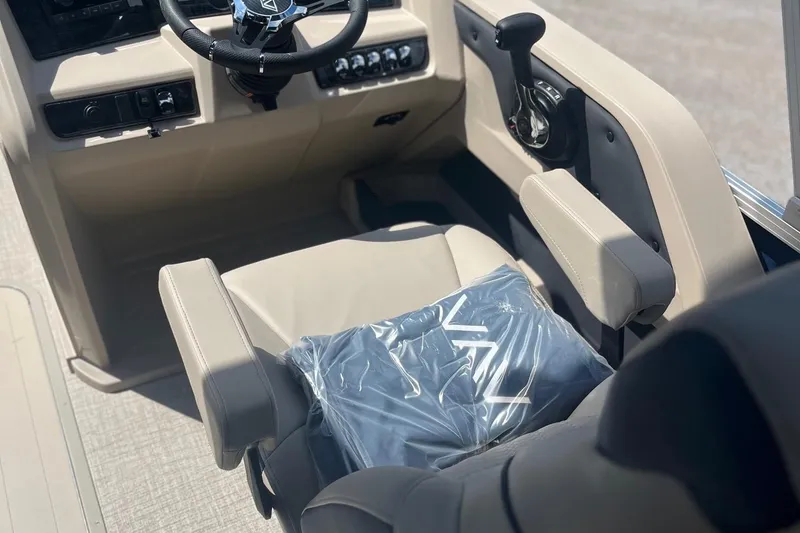 Slide: The Image of 2026 Avalon 23 LSZ Quad Lounger helm with steering wheel and controls. - 5