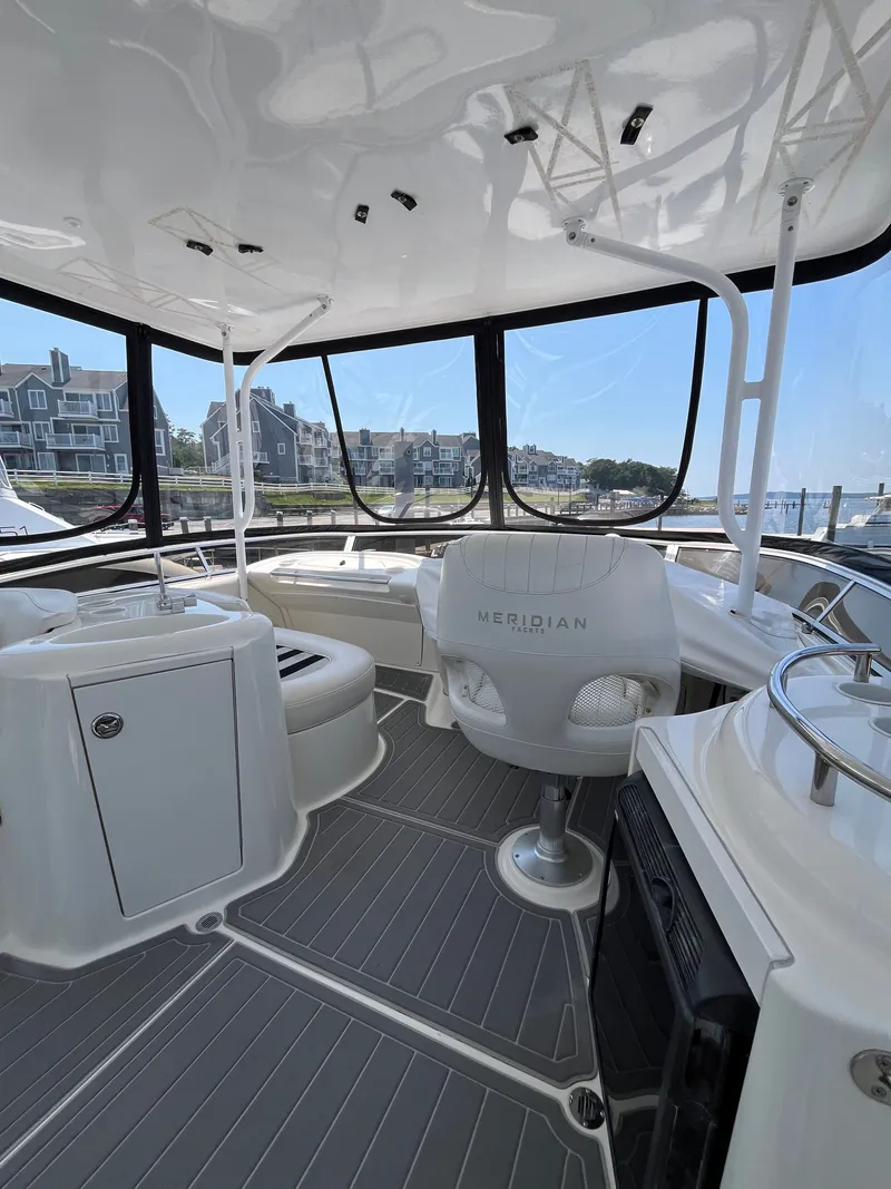 Slide: The Image of Interior of 2008 Meridian 391 Sedan yacht with modern seating and panoramic windows. - 12