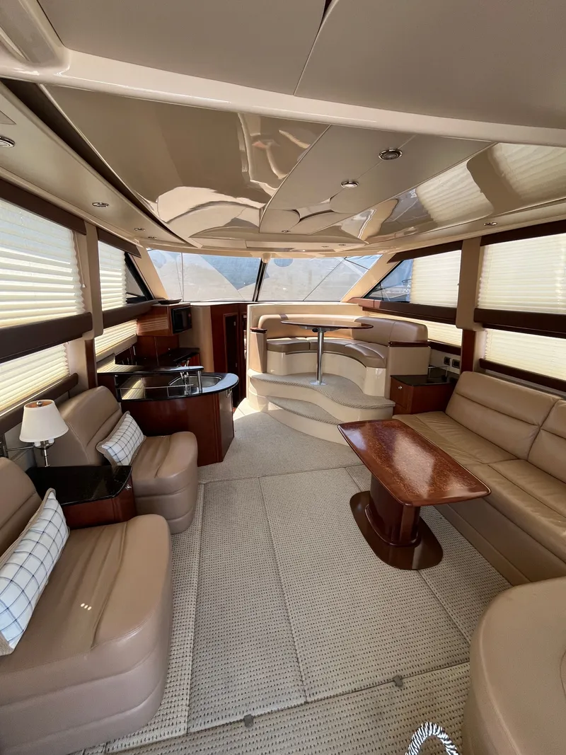 Slide: The Image of Luxurious interior of a 2008 Meridian 391 Sedan yacht with elegant seating and dining area. - 17