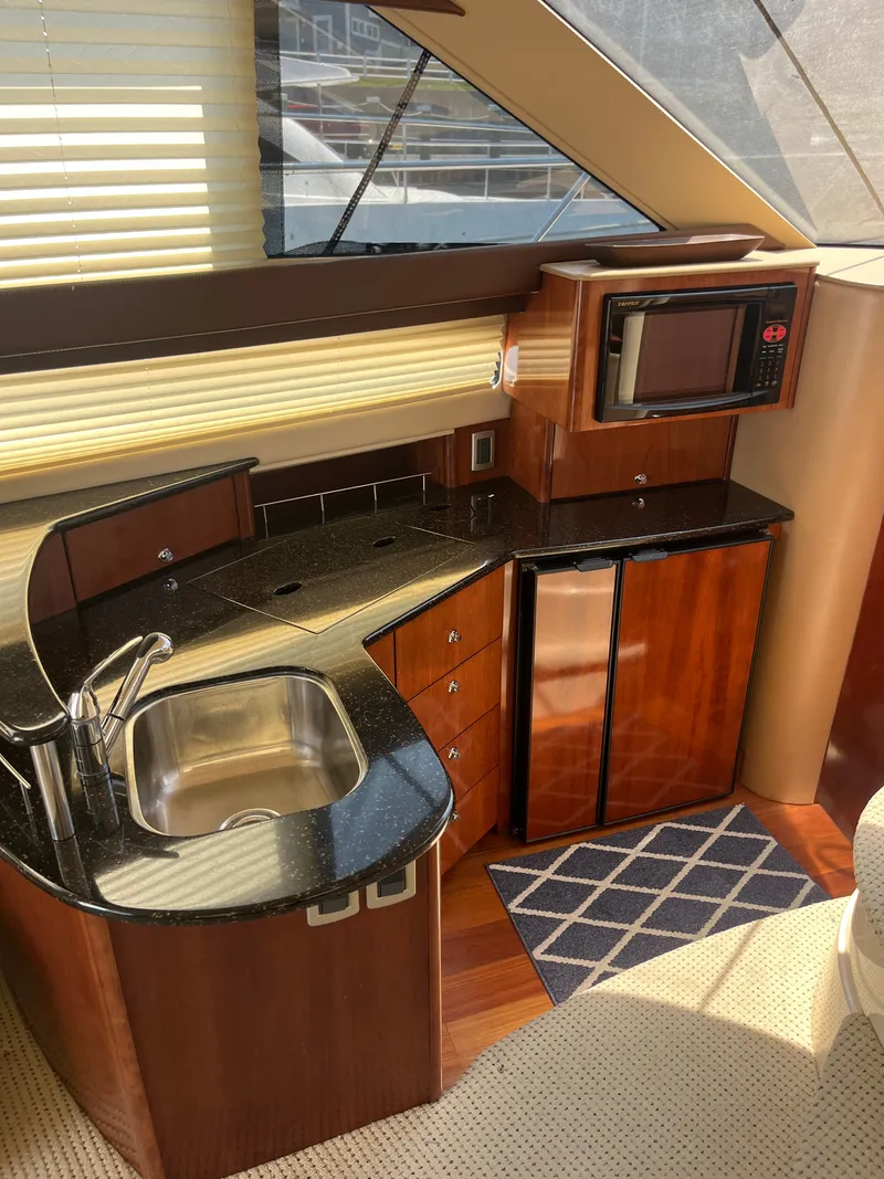 Slide: The Image of Luxurious 2008 Meridian 391 Sedan yacht kitchen with modern appliances and sleek design. - 21