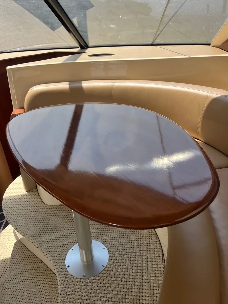 Slide: The Image of Luxurious interior of 2008 Meridian 391 Sedan with polished wooden table and leather seating. - 22