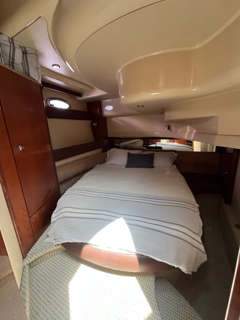 Slide: The Image of Interior cabin of 2008 Meridian 391 Sedan yacht with cozy bed and wooden accents. - 27