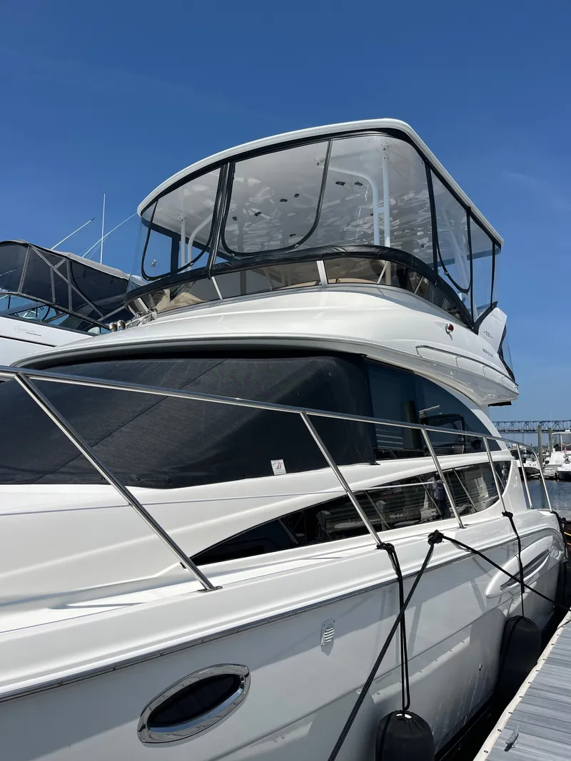 Slide: The Image of 2008 Meridian 391 Sedan yacht docked under clear blue sky. - 3