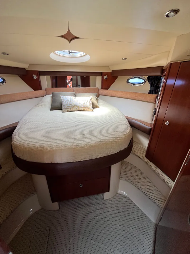 Slide: The Image of Luxurious cabin interior of 2008 Meridian 391 Sedan yacht with plush bedding. - 30