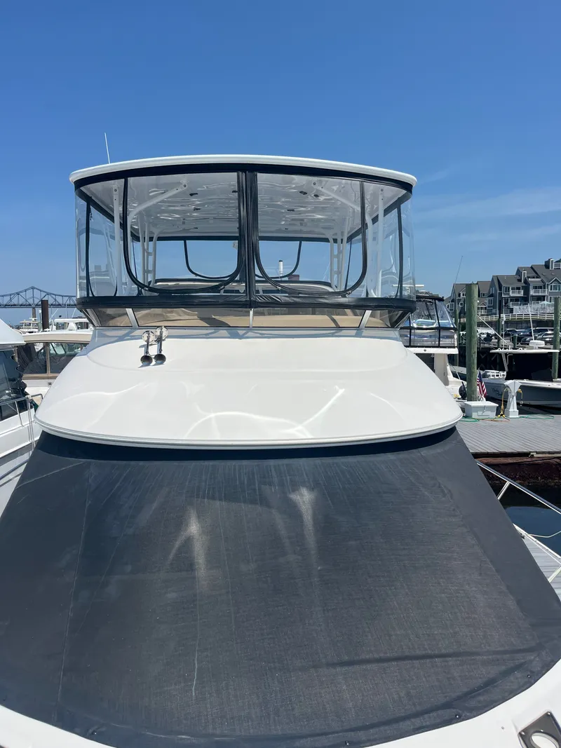 Slide: The Image of 2008 Meridian 391 Sedan yacht docked at marina under clear blue sky. - 6