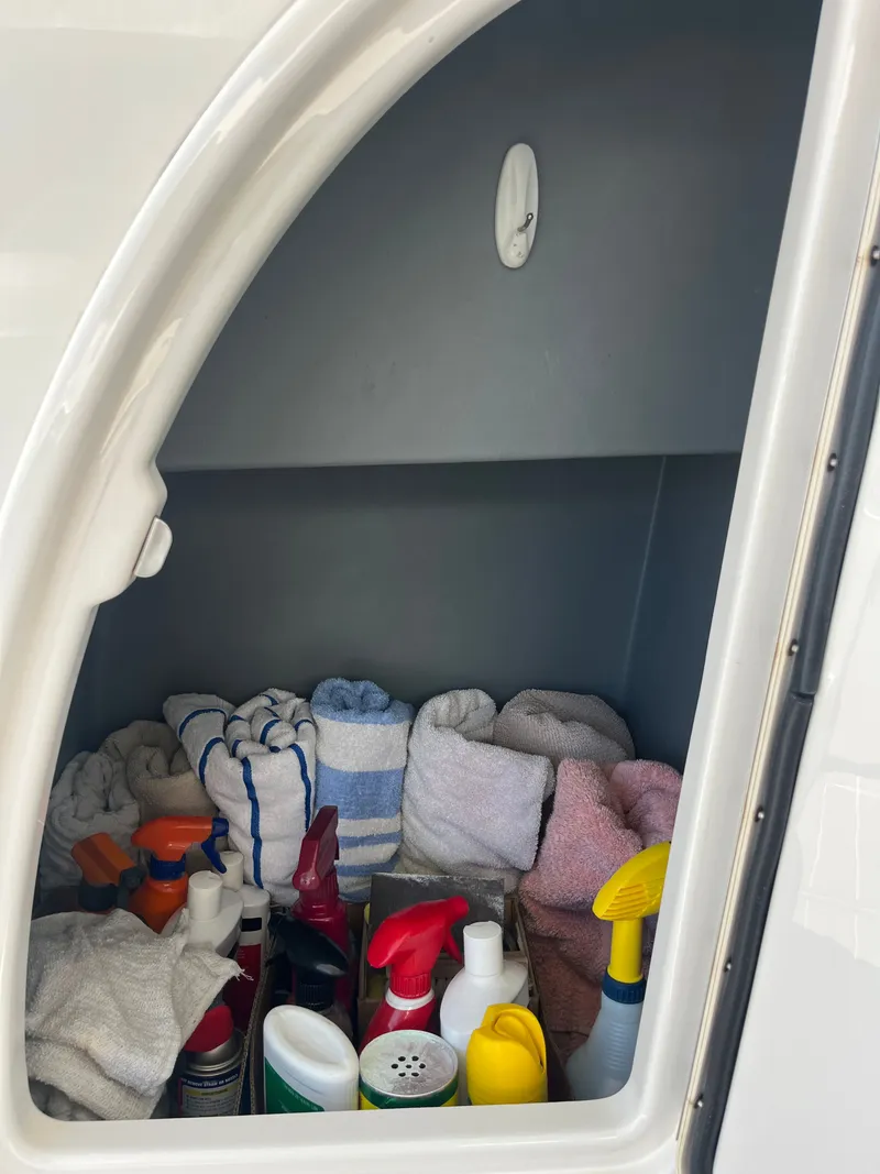 Slide: The Image of Storage compartment with cleaning supplies and towels on a 2008 Meridian 391 Sedan. - 7