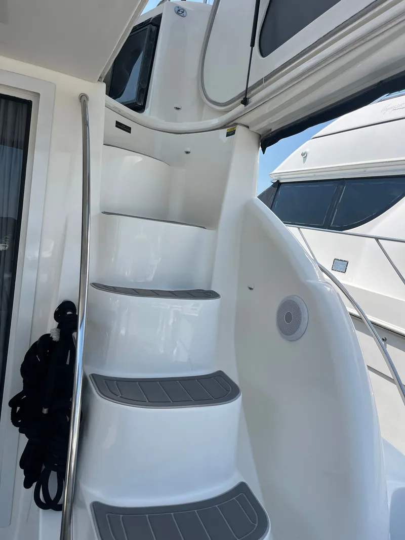 Slide: The Image of Staircase on 2008 Meridian 391 Sedan yacht, featuring sleek white design and safety rail. - 8