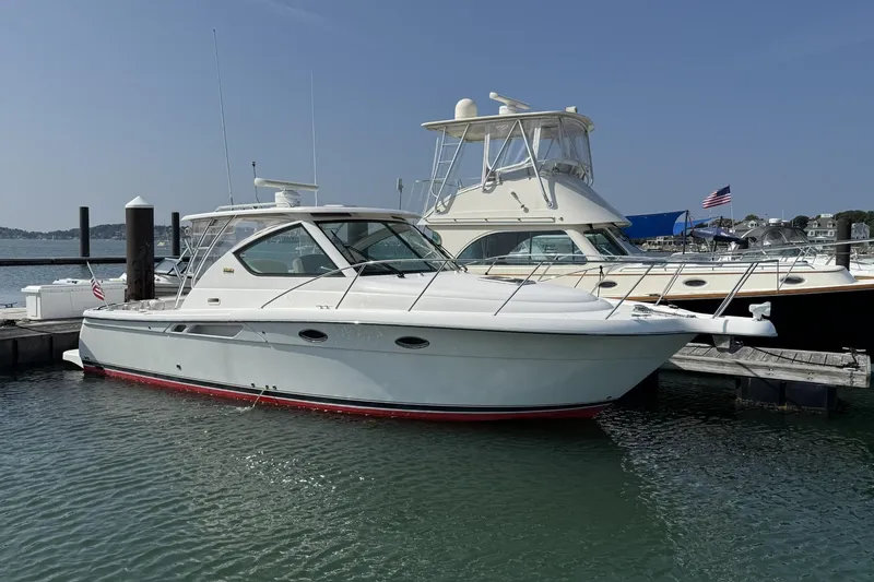 The Image of 2008 Tiara Yachts 3000 Open docked in a marina on a sunny day. - 0