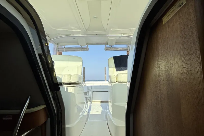 Slide: The Image of 2008 Tiara Yachts 3000 Open interior view with seating and open deck. - 14