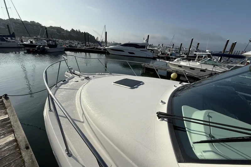 Slide: The Image of 2008 Tiara Yachts 3000 Open docked at marina, surrounded by other boats. - 7