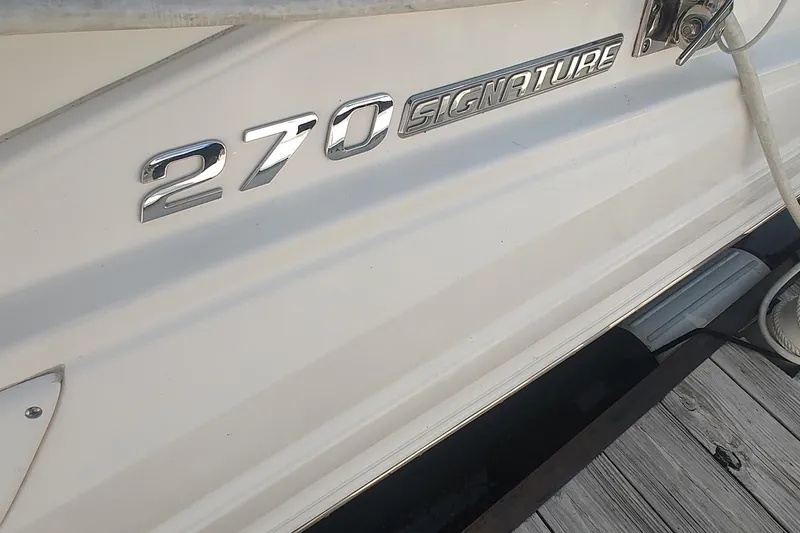 Slide: The Image of 2015 Chaparral 270 Signature boat nameplate on white hull. - 4