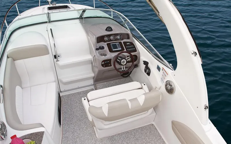 Slide: The Image of Manufacturer Provided Image: 2015 Chaparral 270 Signature boat cockpit with steering wheel and seating. - 8