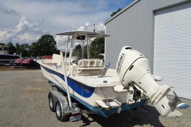 Slide: The Image of 2018 Carolina Skiff 258 DLV boat with Suzuki outboard motor on trailer. - 10