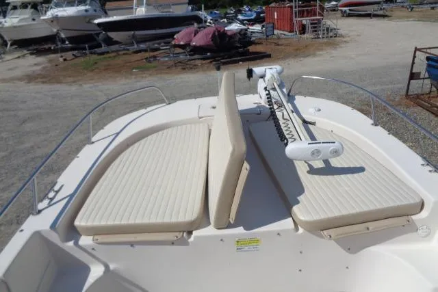 Slide: The Image of 2018 Carolina Skiff 258 DLV boat deck with seating and trolling motor. - 11