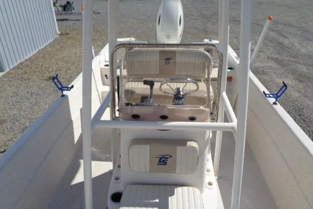 Slide: The Image of 2018 Carolina Skiff 258 DLV boat interior with steering console and seating. - 15