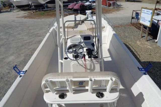 Slide: The Image of 2018 Carolina Skiff 258 DLV boat interior with steering console and rod holders. - 19