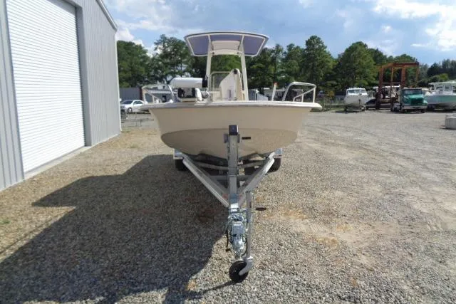 Slide: The Image of 2018 Carolina Skiff 258 DLV boat on trailer, parked outdoors. - 2