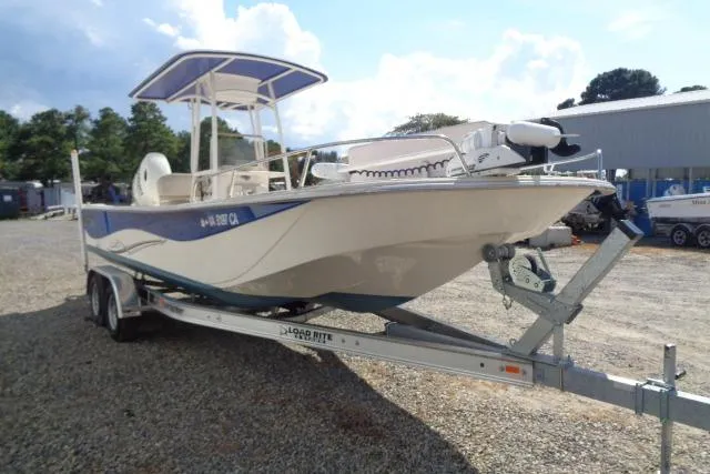 Slide: The Image of 2018 Carolina Skiff 258 DLV boat on trailer, parked outdoors. - 6