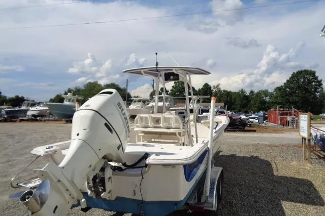 Slide: The Image of 2018 Carolina Skiff 258 DLV boat with Suzuki outboard motor on a trailer. - 8
