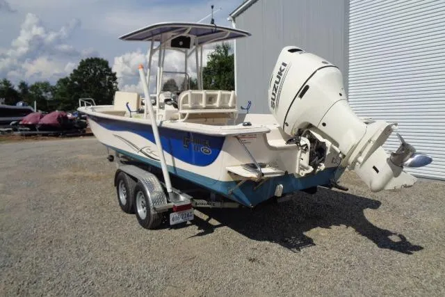 Slide: The Image of 2018 Carolina Skiff 258 DLV boat with Suzuki outboard motor on a trailer. - 9