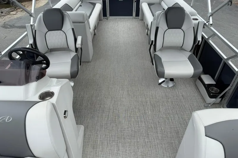 Slide: The Image of 2024 Avalon VENTURE 85 QUAD LOUNGER interior with gray seating and steering console. - 10