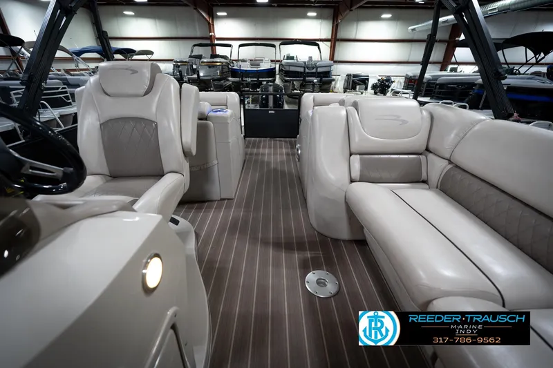 Slide: The Image of 2016 Bennington 2375 GCW pontoon boat interior with luxurious seating and modern design. - 15