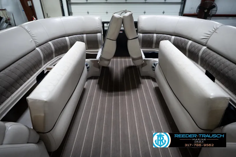 Slide: The Image of 2016 Bennington 2375 GCW pontoon boat interior with plush seating and striped flooring. - 20
