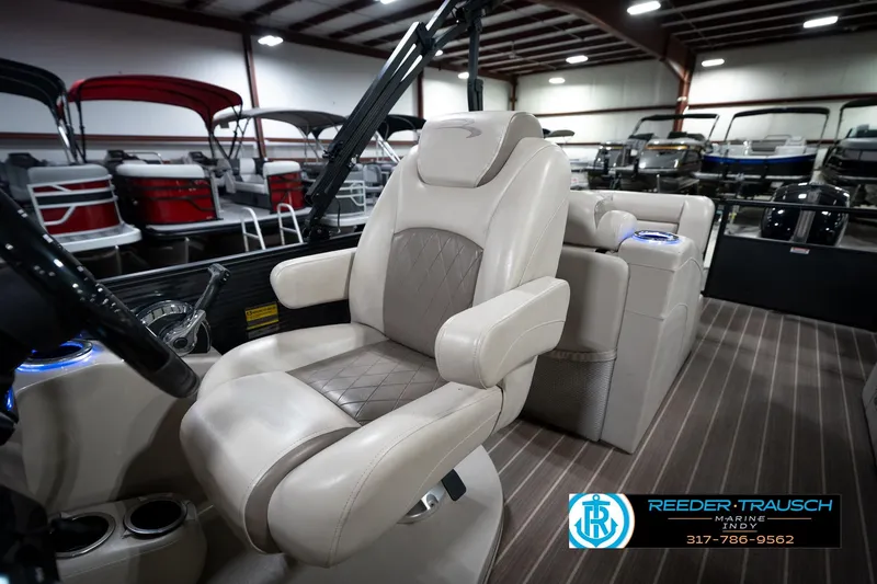 Slide: The Image of 2016 Bennington 2375 GCW boat interior with luxurious captain's chair and modern design. - 22