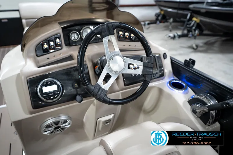Slide: The Image of 2016 Bennington 2375 GCW boat dashboard with steering wheel and control panel. - 29