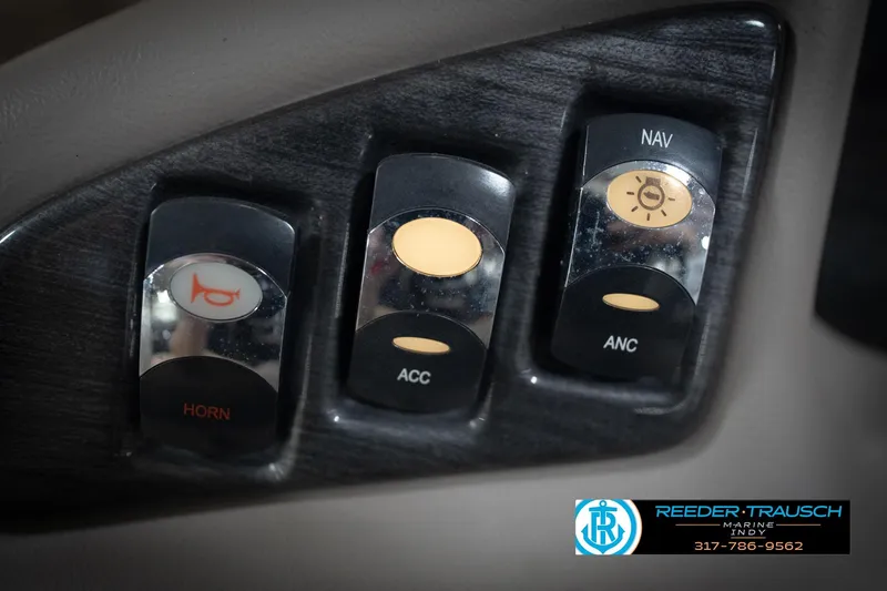 Slide: The Image of Control panel of a 2016 Bennington 2375 GCW boat with horn, accessory, and navigation switches. - 32