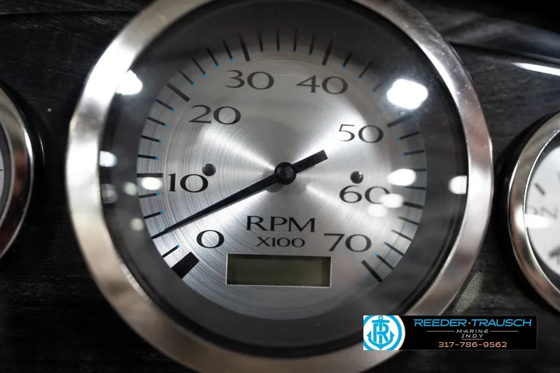 Slide: The Image of Close-up of a 2016 Bennington 2375 GCW RPM gauge, displaying up to 70 RPM X100. - 34