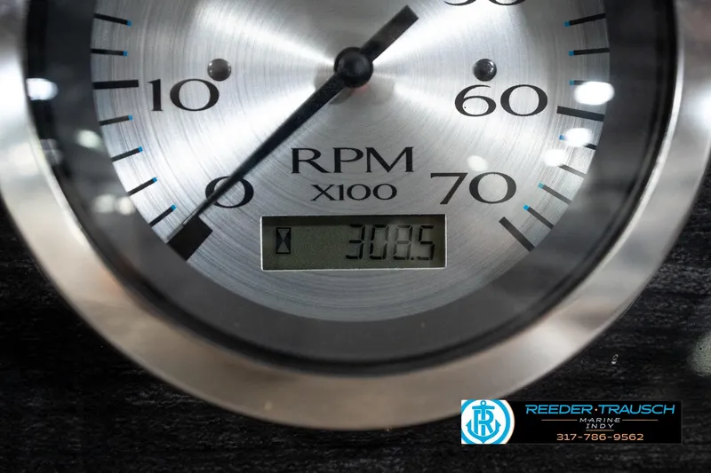 Slide: The Image of Close-up of a 2016 Bennington 2375 GCW RPM gauge displaying 308.5 hours. - 35