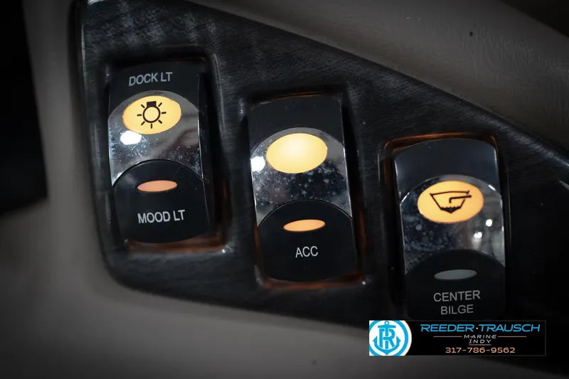 Slide: The Image of Control panel of a 2016 Bennington 2375 GCW boat with illuminated switches. - 37