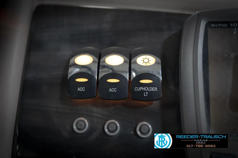 Slide: The Image of Control panel of a 2016 Bennington 2375 GCW boat with illuminated switches. - 38