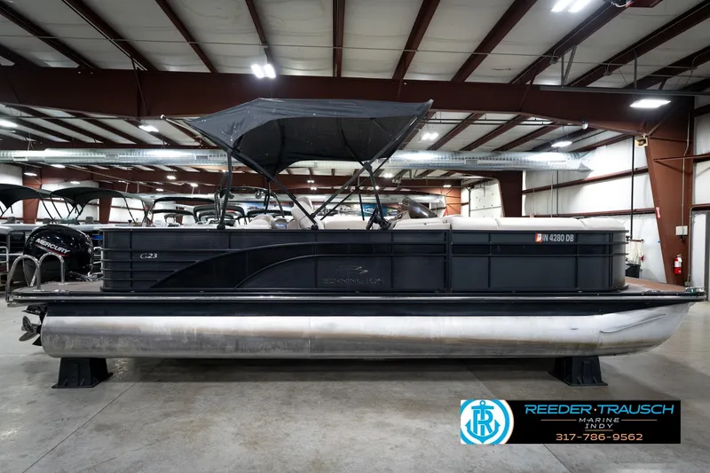 Slide: The Image of 2016 Bennington 2375 GCW pontoon boat in indoor showroom, side view. - 5