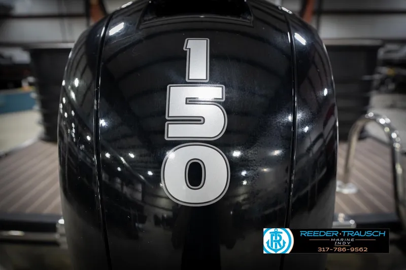 Slide: The Image of Close-up of a 2016 Bennington 2375 GCW boat engine with "150" marking. - 53