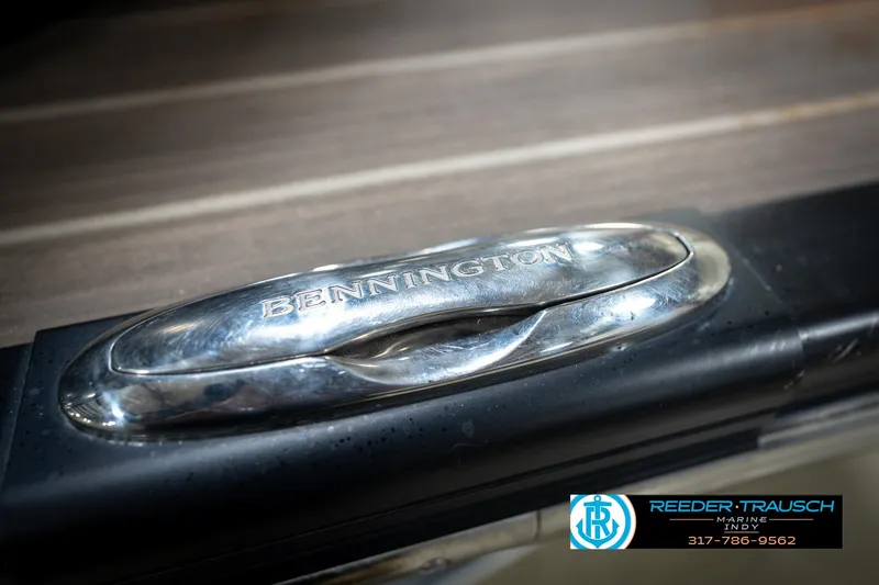 Slide: The Image of Close-up of a 2016 Bennington 2375 GCW boat cleat with Reeder-Trausch Marine logo. - 59