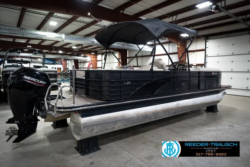 Slide: The Image of 2016 Bennington 2375 GCW pontoon boat with Mercury engine in showroom. - 6