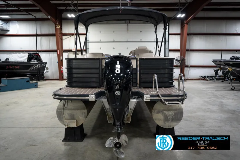 Slide: The Image of 2016 Bennington 2375 GCW pontoon boat with 150 HP engine in a showroom. - 7