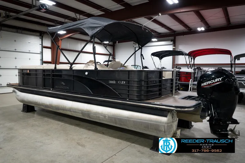 Slide: The Image of 2016 Bennington 2375 GCW pontoon boat with Mercury engine in indoor showroom. - 8