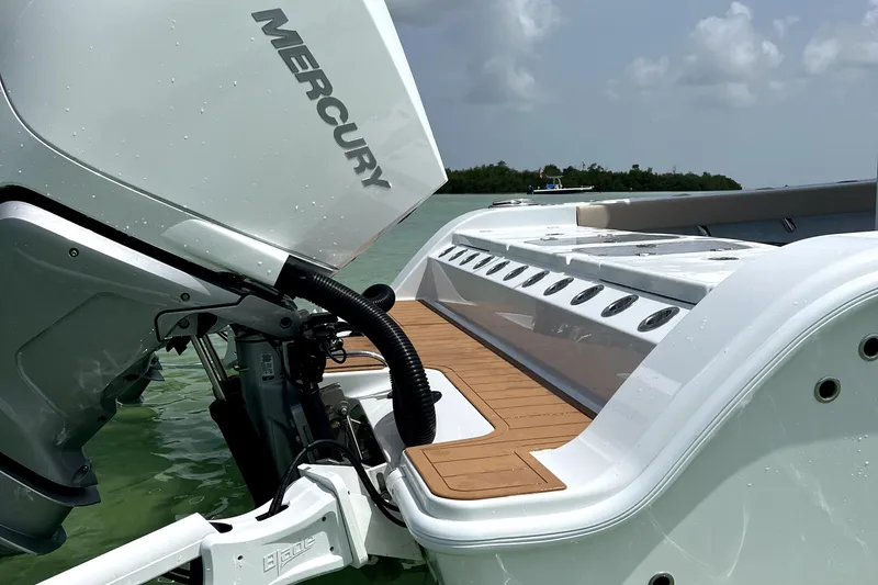 Slide: The Image of Freeman 28 boat with Mercury engine, 2024 model, docked in clear waters. - 14