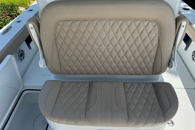 Slide: The Image of 2024 Freeman 28 boat seat with diamond-stitched beige upholstery. - 18