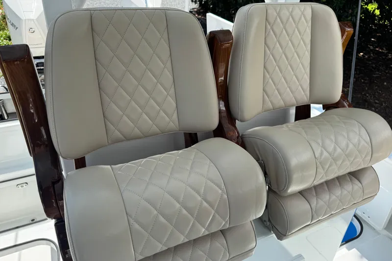 Slide: The Image of Luxurious beige leather boat seats with diamond stitching on a 2024 Freeman 28. - 19