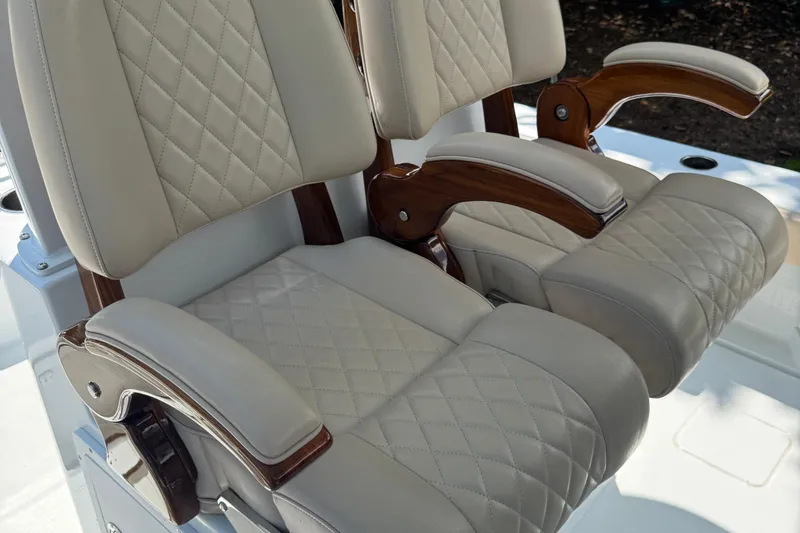 Slide: The Image of Luxurious leather seats with wooden armrests on a 2024 Freeman 28 boat. - 20