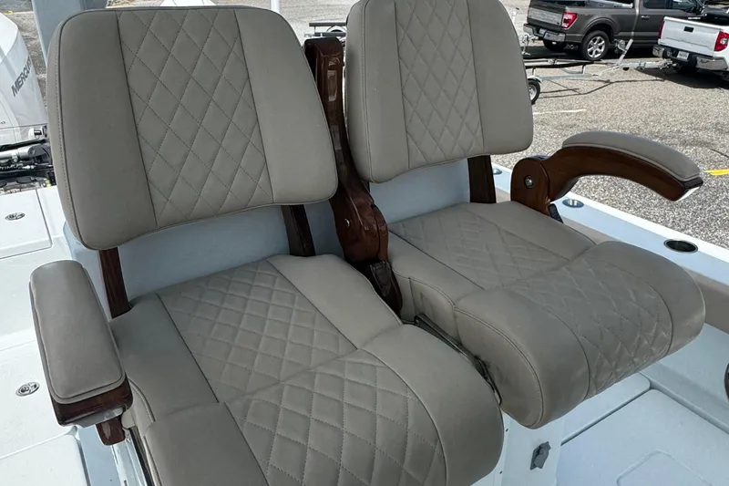 Slide: The Image of Luxurious seating on a 2024 Freeman 28 boat, featuring diamond-stitched upholstery. - 29