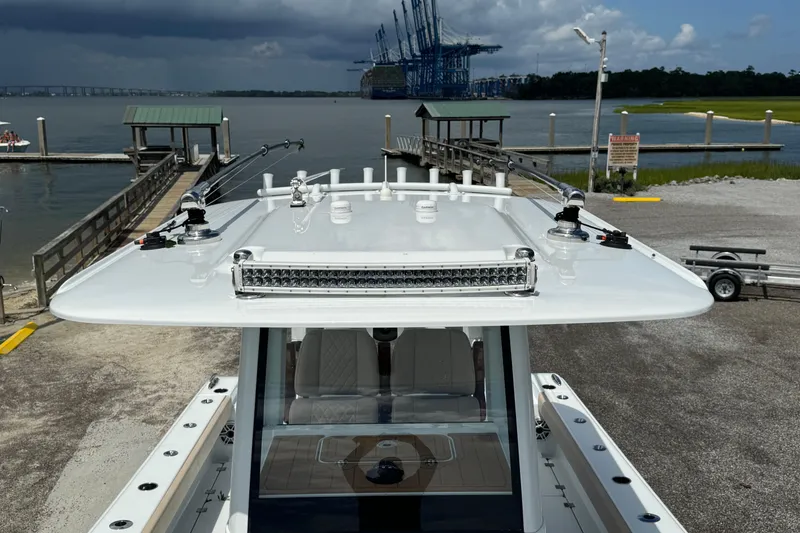 Slide: The Image of 2024 Freeman 28 boat docked at marina with overcast sky. - 33